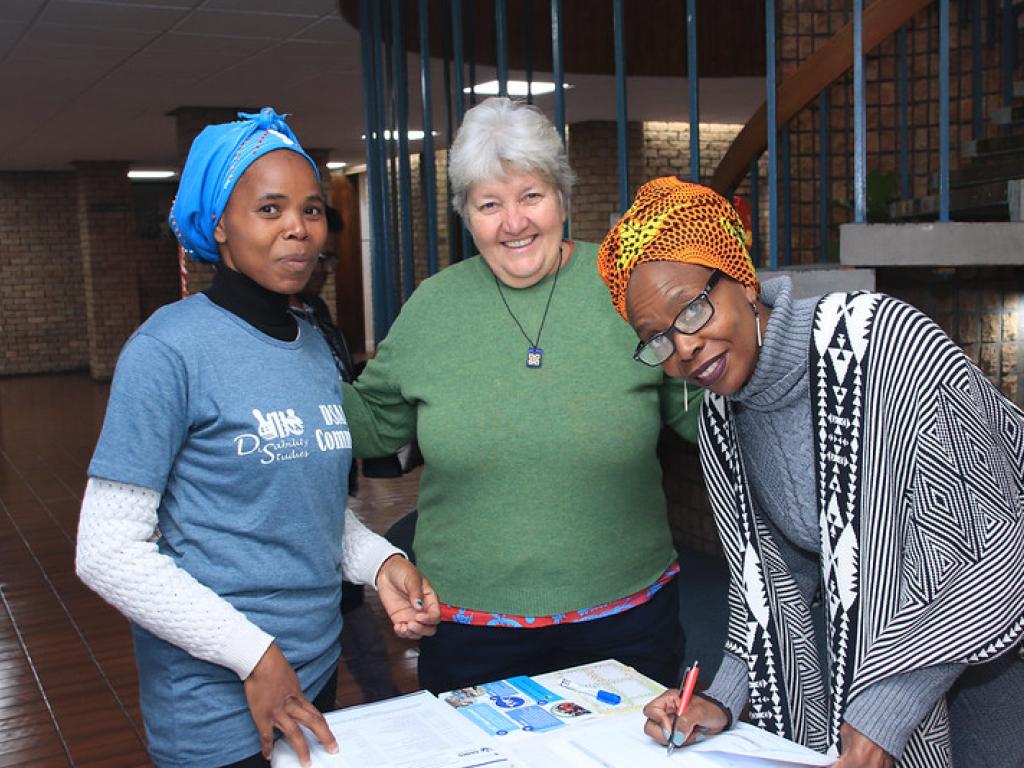 Professor Theresa Lorenzo and Elelwani Ramugondo with a student assistant at the Disability Studies Alumni Affinity Group Launch